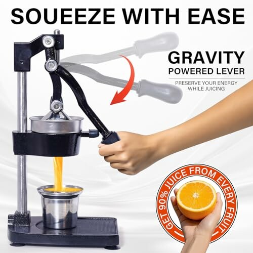 Manual juicer with gravity lever squeezing orange juice.